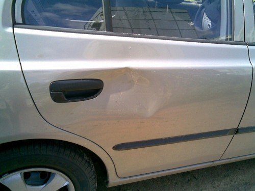 Dent in Your Car Door? Fix It Yourself!